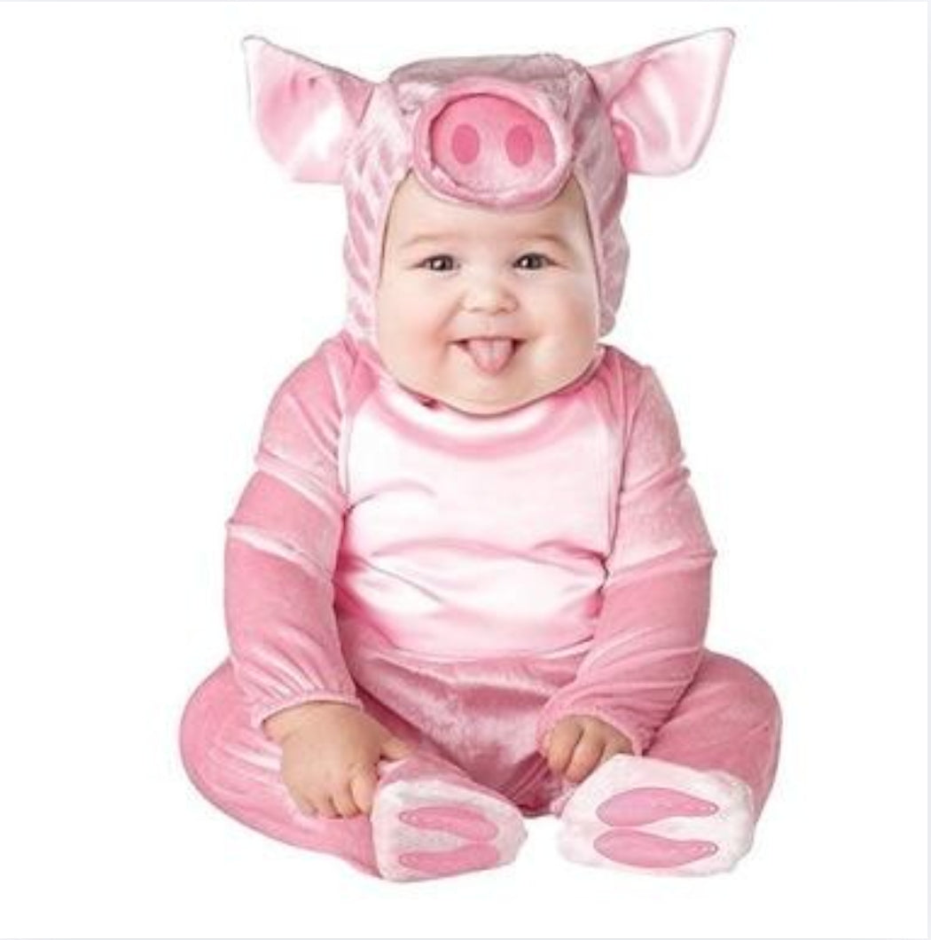 Bébé portant un déguisement de cochon